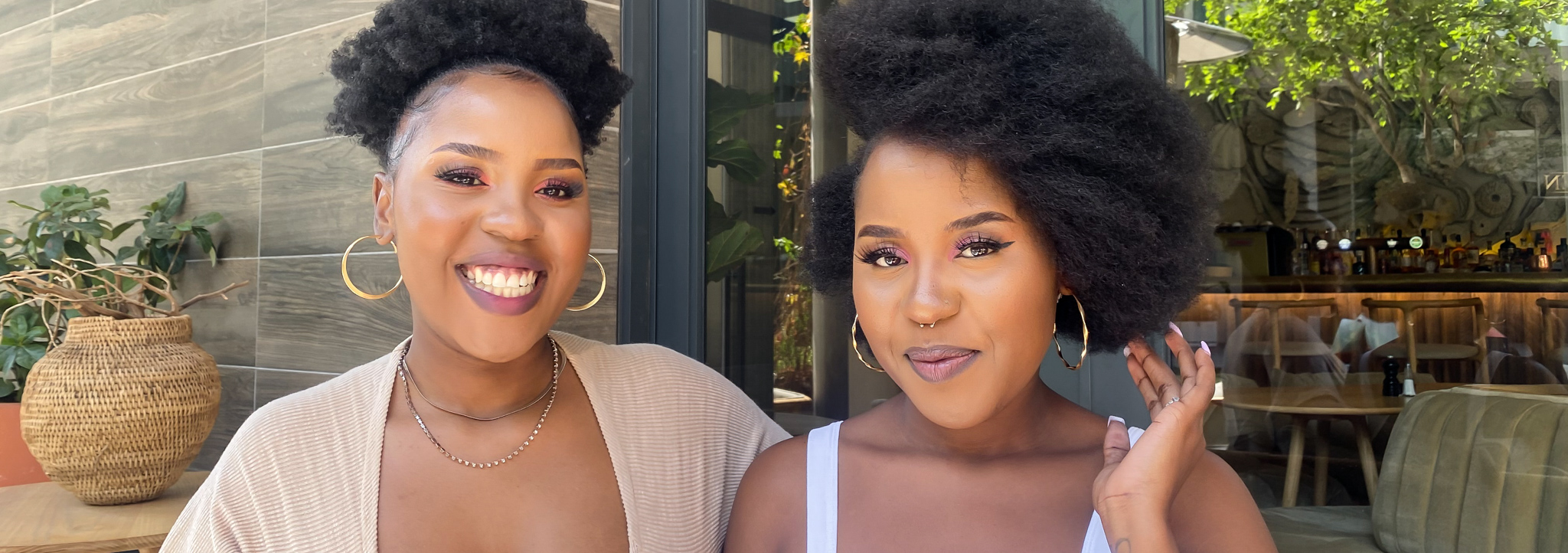 Two women smiling with natural hair afro, afro styling tips, natural hair tips, the suite, the suite edit, brutal fruit