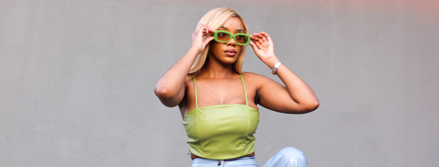 woman in a green leather strap top with blonde hair and sunglasses, hot girl summer, katlego tefu, the suite, the suite edit, brutal fruit