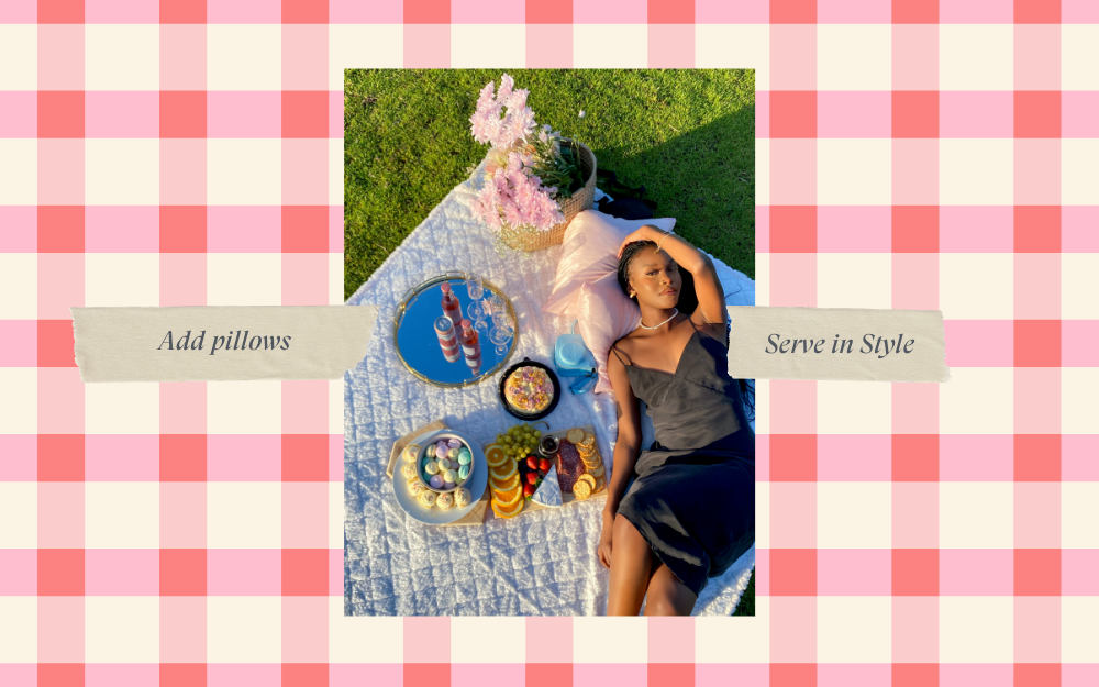 woman at a picnic in a black dress holding a drink, summer picnic, instagrammable picnic, the suite, the suite edit, brutal fruit
