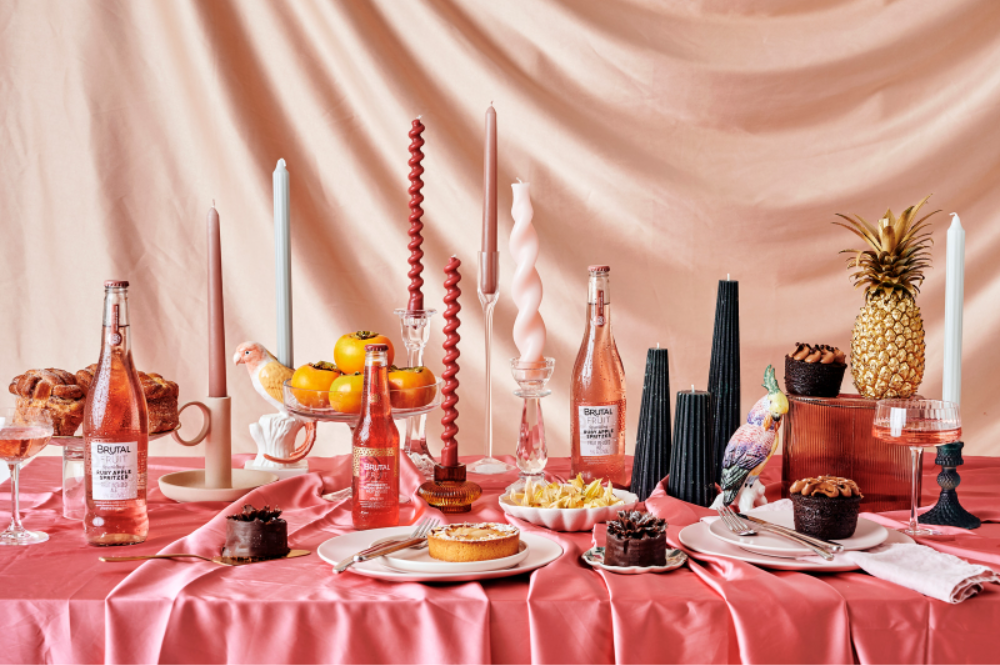 brunch spread with cake, spritzers and brutal fruit, the suite, the suite edit, entertaining, hosting, table decorating ideas, candle, candles, satin